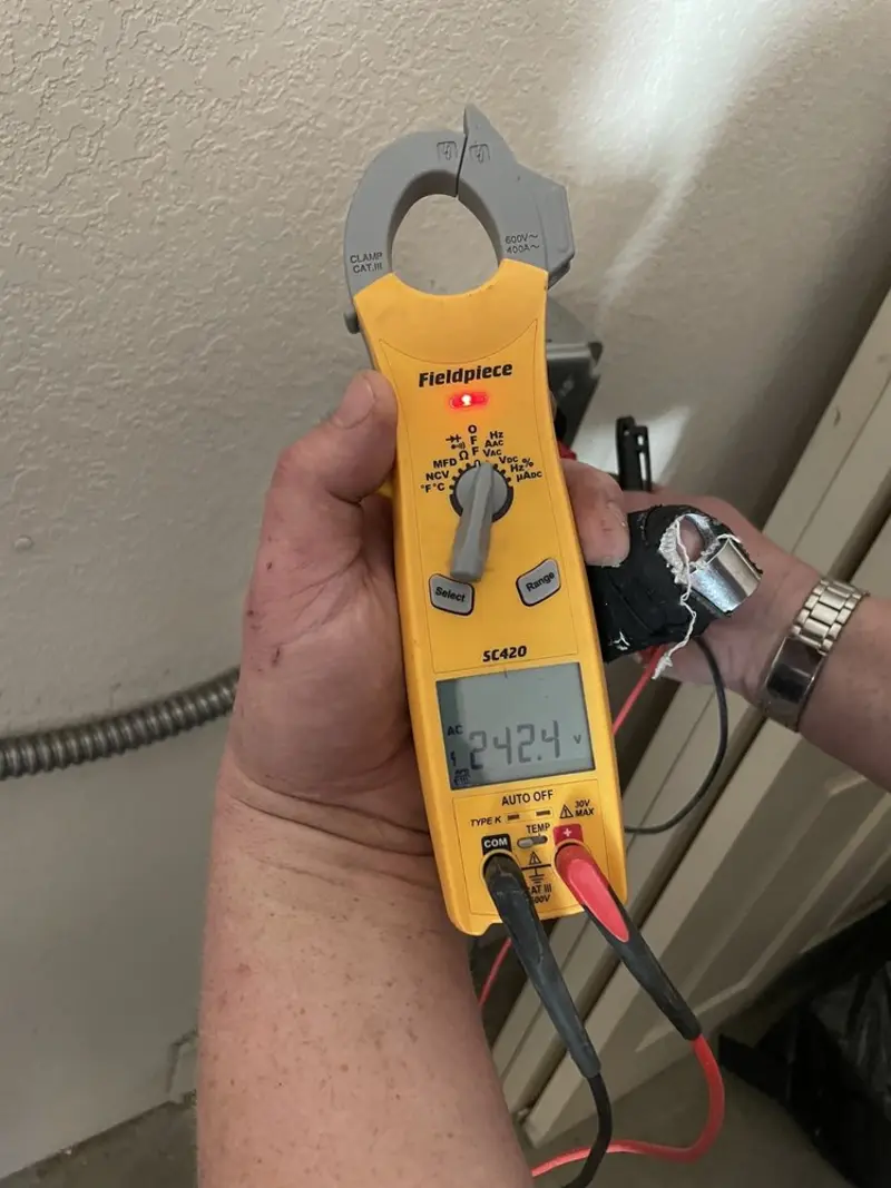 Voltage testing with clamp meter during Electrical Installation Services in Forestville